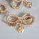 Decor for creativity plastic "Double bow with heart" set 10 pcs 4.5x3.3 cm