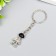 Metal keychain "Cosmonaut with black helmet" silver 2.9x1.5x0.5 cm