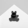 Bunny icon with a camera, white-pink color in ferrous metal