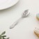 A teaspoon spoon with an engraving “The most charming and attractive”, h = 14cm.