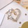 Brooch "Heart" in berries, white color in gold