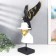 Polystone souvenir "A man in a white hat with a black bird behind him" 48x23x19 cm