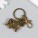 Keychain metal with carbine "Elephants" bronze 6.5 cm