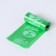A container with a flashlight, cleaning packages for dogs (roll 15 pcs), green