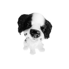 Dog on a car panel shocking his head, spaniel