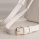 A backpack with a zipper, Textura, external pocket, white color