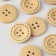 Buttock, 4 punctures, d = 23 mm, beige color