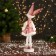 New Year's jester "in a dress with sequins and fur" 30 cm, pink-white