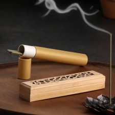 A set of incense with a stand 