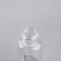 A bottle for storage, with a spray, with a division scale, 30 ml, white/transparent color