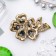 Brooch "Flower of desires", emerald color in black gold