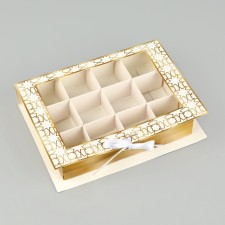 Box under 12 sweets with cells of 