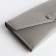 Women's wallet on the button, gray color