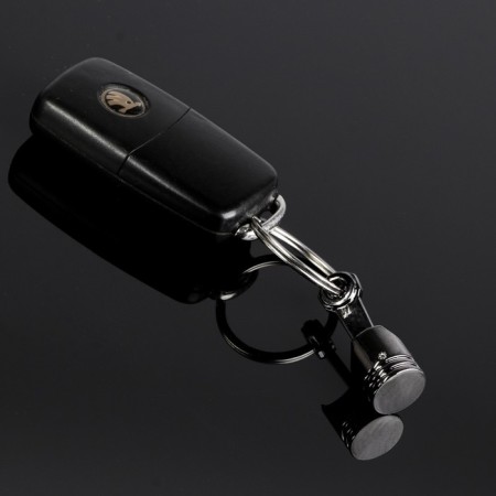 Cartage keychain, piston, metal, black