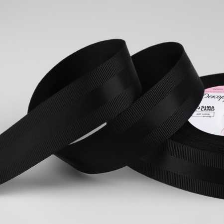 The tape is decorative, repression/satin, 25 mm, 18 ± 1 m, black color