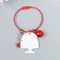 Acryl keychain on a cable with a bell "Baby in a red beret with a rose"