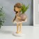 Souvenir Polystone "Baby with a scythe, with a plant in a vase" 21x9x11.3 cm