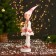 New Year's jester "in a dress with sequins and fur" 30 cm, pink-white