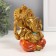 Souvenir Polystone for bronze "Ganesha, in orange haremasses" 10x10x12.5 cm