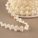 Pearls on threads, flat, 10 mm, 9 ± 1 m, white color