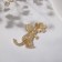 Brooch "Kithe" with a flower, white-pink color in gold