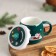 Ceramic mug with silicone lid of the Santa Claus, 380 ml, green color