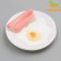 Toy squeezing "breakfast" for dogs, 13.5 cm, on a white plate