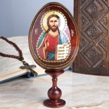 Souvenir egg on the stand icon 