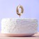 Candle for the cake, number "0", champagne.