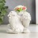Polystone souvenir "Snowthrough angel with a rose, in a wreath of roses" MIXs 8x7.2x6 cm
