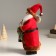Interior doll "Santa Claus with gifts, a wreath and a flashlight" 37 cm