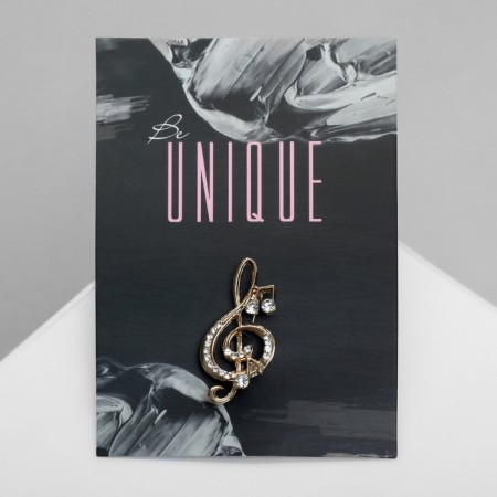 Brooch "Violin key" and notes, white color in gold