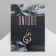 Brooch "Violin key" and notes, white color in gold