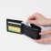 Male purse on a button, for bills, for cards, for coins, black color