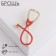 Brooch "Stethoscope", red color in gold