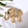 Brooch "Indian Elephant", white color in gold