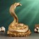 Piggy bank "Cobra on money" gold 25x18x20cm