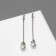 Earrings with pearls "Beads on a stick", white color