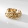 Ring Metal "Tren" is crumpled, the color is gold, dimensionless