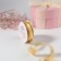 The tape is decorative, nylon/satin, with lurex, 25 mm, 18 ± 1 m, gold color