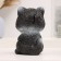 Piggy bank "Cat with flower" black, 18 cm