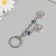 Keychain from the evil eye Metal "two suns" 9 cm