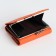 Women's wallet on the button, orange color