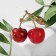 Brooch "Cherry" with a bone, the color is red-green in gold