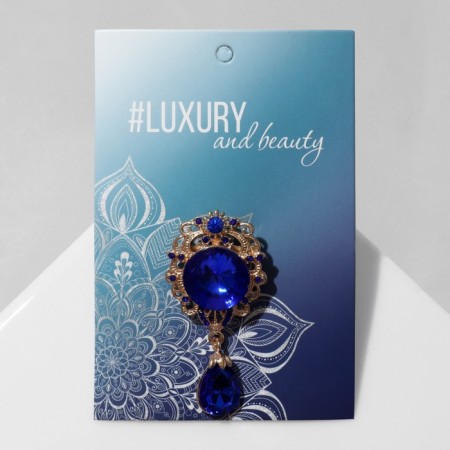 Obval brooch with a drop, the color is blue in gold