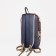 A backpack with a zipper, brown color/pixels