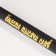 Lacked bat "instead of a thousand words", black with a gold inscription, 65 cm