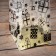 A package with a hard bottom of 14 x 14 x 45 gold "gifts"
