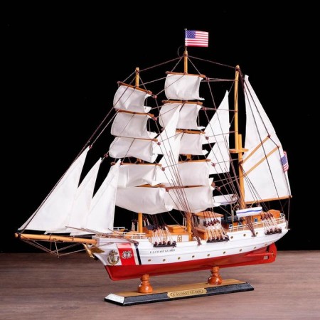 The ship souvenir "conductor", 3 masts, white side, black stand, white sails