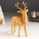 Souvenir Polystone "Golden Deer with a wreath on the neck" 11.8x5.7x16.8 cm
